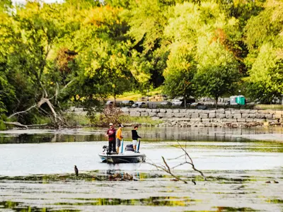 People fishing on a boat in the summer 