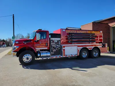 A red Greater Napanee firetruck in a parking lot